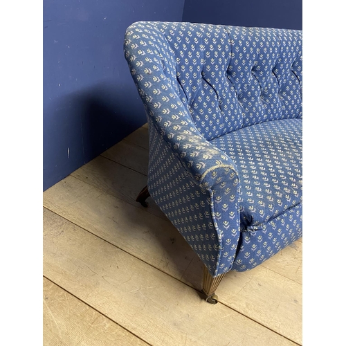 498 - Howard style sofa, with reeded mahogany legs and brass castors, blue upholstery in need of a clearn,... 