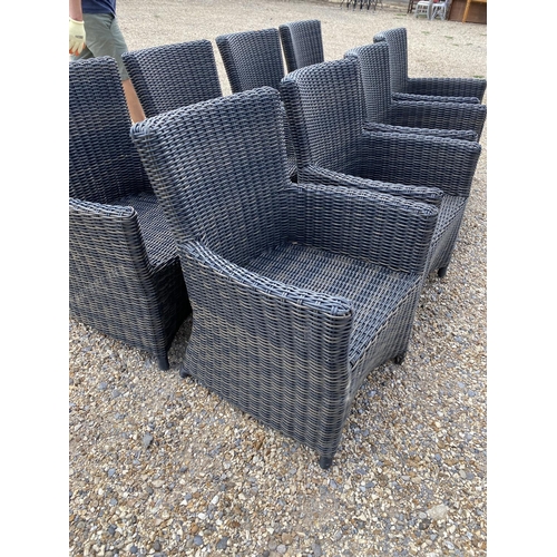 503 - A good set of 8 wicker effect brown garden arm chairs, some minor wear to some legs where the bound ... 