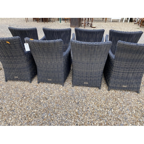 503 - A good set of 8 wicker effect brown garden arm chairs, some minor wear to some legs where the bound ... 