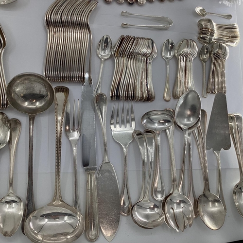 52 - A large collection of French Flatware by Christofle France to include white metal handled knives qua... 