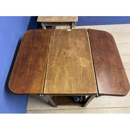 528 - A worn pine scrub top effect kitchen table with stretcher to base; and anther occasional table, with... 