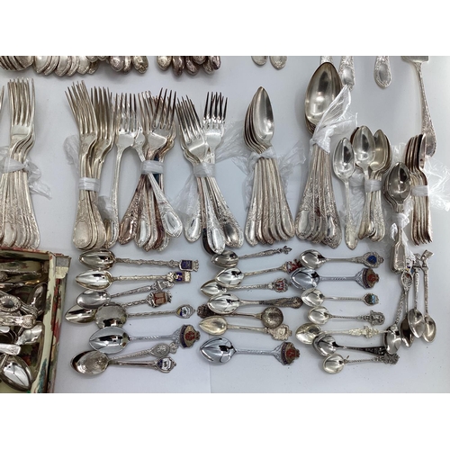 54 - A large collection of plated flatware and kitchen utensils