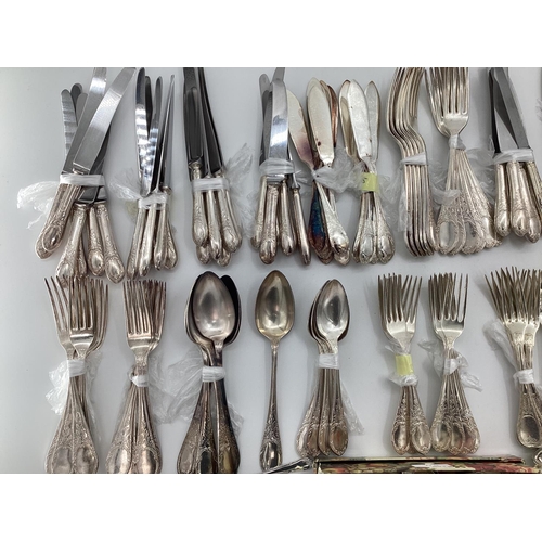 54 - A large collection of plated flatware and kitchen utensils