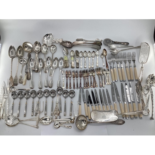 54 - A large collection of plated flatware and kitchen utensils