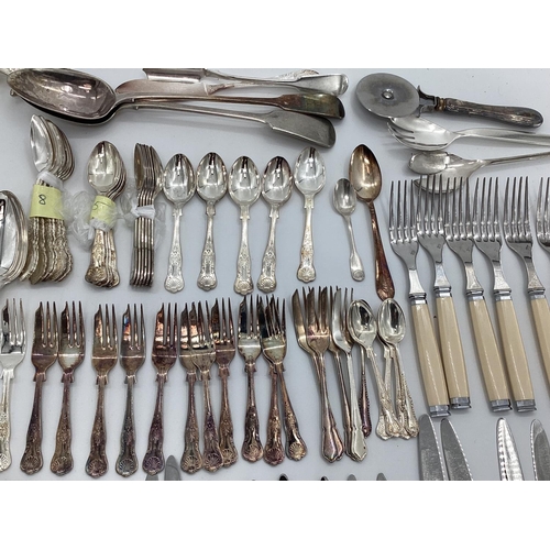 54 - A large collection of plated flatware and kitchen utensils