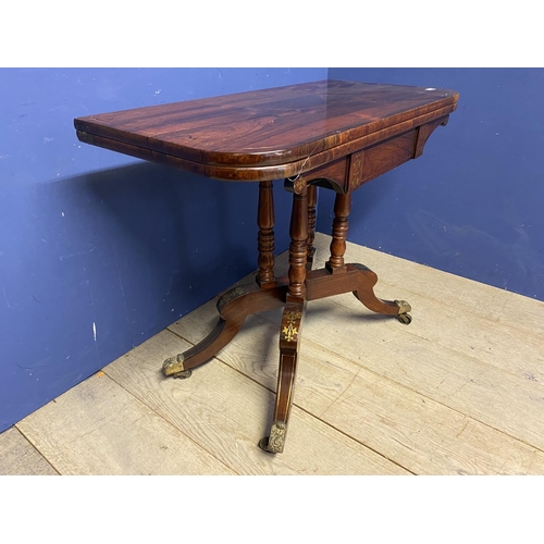 541 - A Georgian flame mahogany/rosewood fold over card table