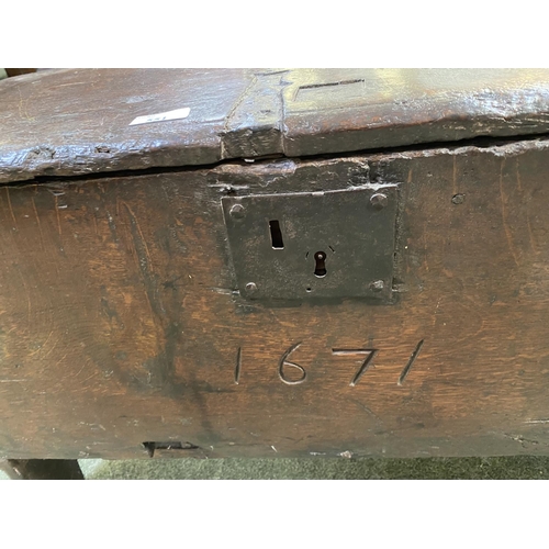 551 - A small part C17th oak coffer with rising lid, with 1671 date carved to front, 77cmW x 33cmD x 48cmH