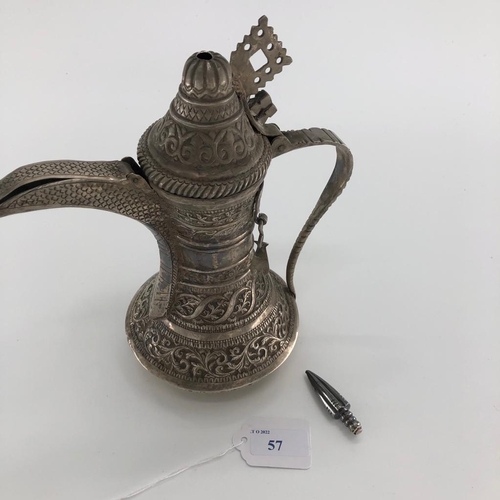 57 - An Indian /Omani style unmarked white metal coffee pot with floral decoration 503g, 25cm H