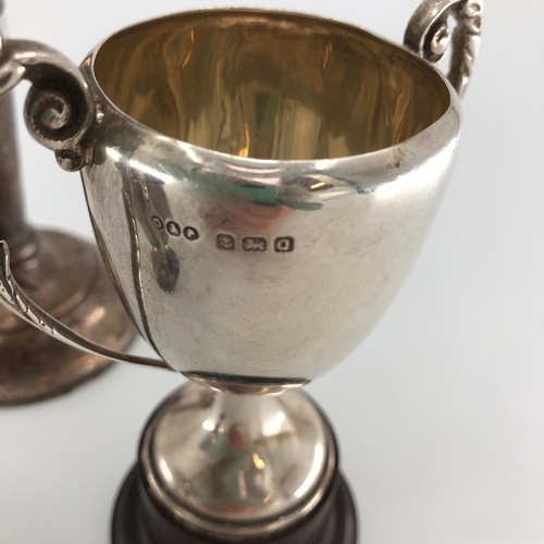 58 - 3 sterling silver items, to include small trophies and trumpet vase