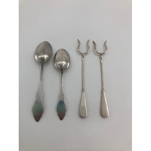 61 - A pair of boxed sterling silver forks set with Scottish hardstones together with a pair of white met... 