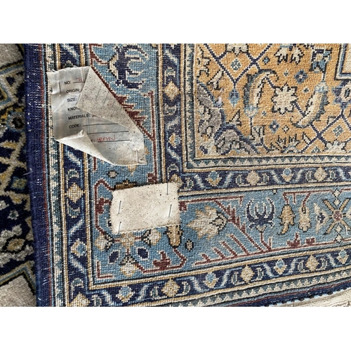 648 - A Qum wool rug, cream and blue ground, 130 x 77cm