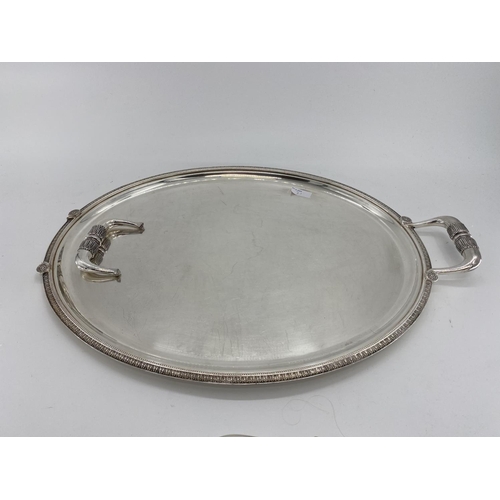 71 - Silver plated condiment holder  (one vacant glass vase) together with four oval plated trays