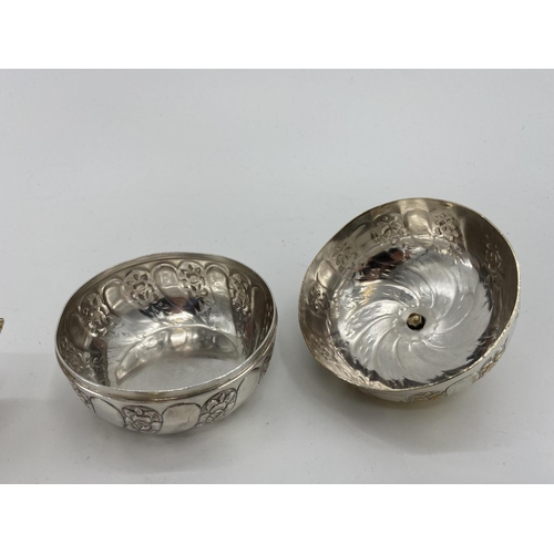 73 - A pair of white metal egg cups in the form of cast chickens with gilt interiors, and a white metal s... 