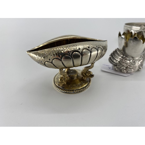 73 - A pair of white metal egg cups in the form of cast chickens with gilt interiors, and a white metal s... 