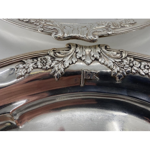 74 - A collection of silver plate to include a pair of oval Elkington & Co dishes and circular footed tra... 