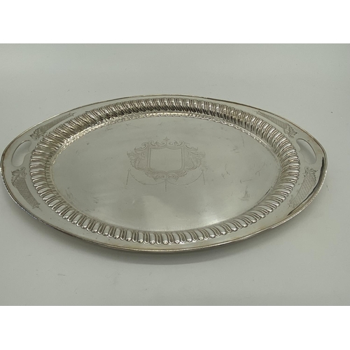 78 - A collection of silver plated oval trays to include a pierced gallery example (5)