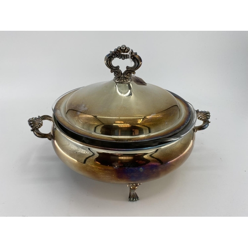 82 - A collection of silver plated items to include two lidded tureens and other items