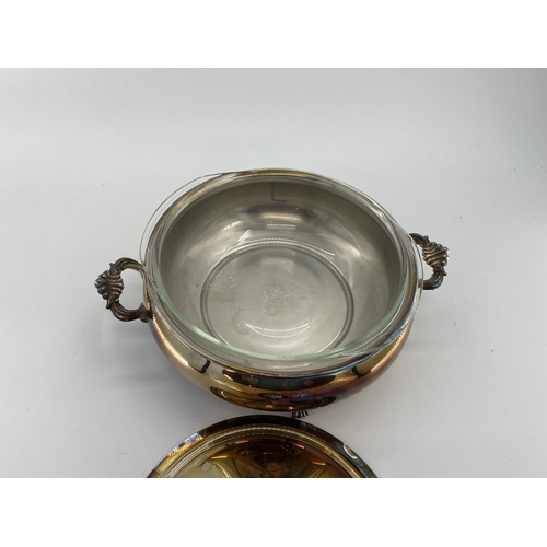 82 - A collection of silver plated items to include two lidded tureens and other items