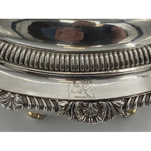 82 - A collection of silver plated items to include two lidded tureens and other items