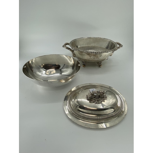 82 - A collection of silver plated items to include two lidded tureens and other items