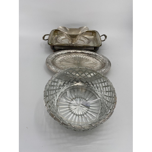 82 - A collection of silver plated items to include two lidded tureens and other items