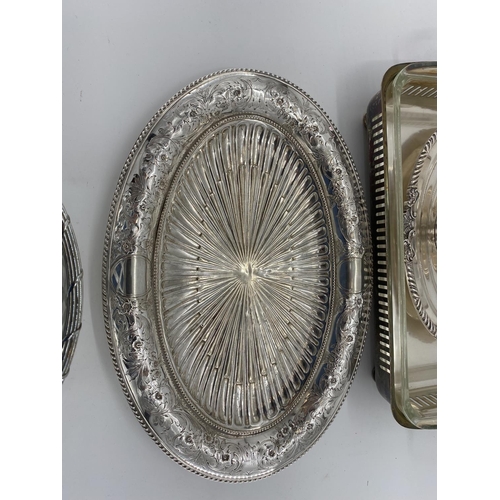 82 - A collection of silver plated items to include two lidded tureens and other items