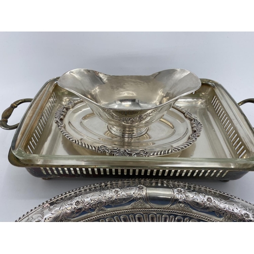 82 - A collection of silver plated items to include two lidded tureens and other items