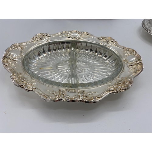 82 - A collection of silver plated items to include two lidded tureens and other items