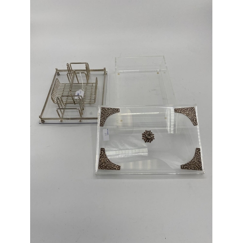 88 - Two white metal and Perspex items to include a desk tidy and a lidded box