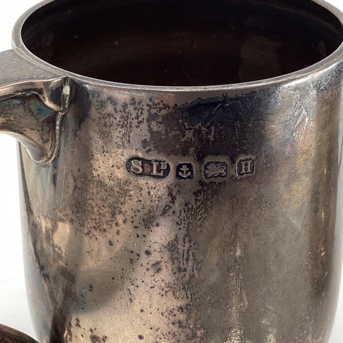 95 - A sterling silver mug, together, together with a silver christening cup and boxed silver handled but... 