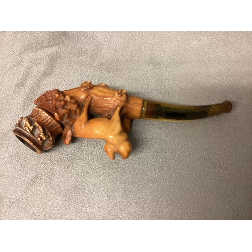 98 - Late C19th early C20th Meersham pipe with Amber mouth piece and topped by a carving of a pig, in fit... 