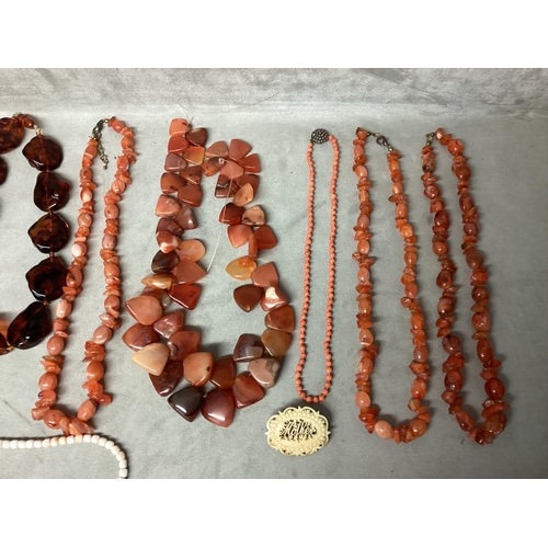 99 - A collection of bead jewellery, to include a dogs tooth corat necklace, carnelian beads and three am... 