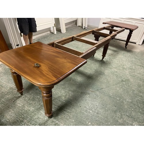 473 - A mahogany square dining table, extending to an oblong metres table, with the extra leaves. Being so... 