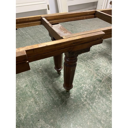 473 - A mahogany square dining table, extending to an oblong metres table, with the extra leaves. Being so... 