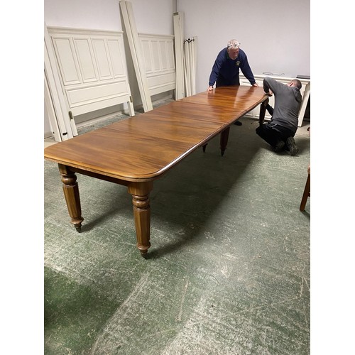 473 - A mahogany square dining table, extending to an oblong metres table, with the extra leaves. Being so... 