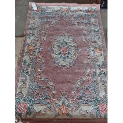 645 - A modern oriental style carpet, pink ground, 120 x 180cm