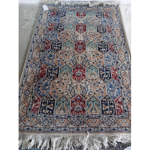 647 - A Nain Wool carpet cream ground, geometric design 176 x 113