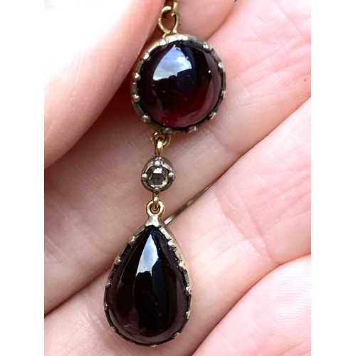 103 - A Pair of Georgian 9ct gold garnet and rose cut diamond drop earrings. Screw fittings suspended circ... 