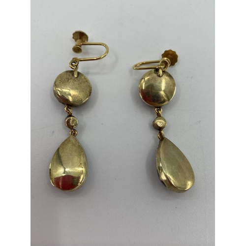 103 - A Pair of Georgian 9ct gold garnet and rose cut diamond drop earrings. Screw fittings suspended circ... 