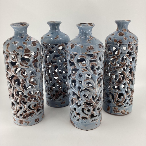 108 - 8 decorative vases to include: Set of four modern blue narrow vases, with folate sides 40cm H, gener... 