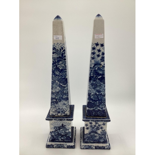 112 - Decorative Modern Blue and White China:  Pair of tall obelisks, with green baize to base, 63cmH, sma... 