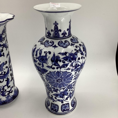 114 - Decorative Modern Blue and White China: a pair of scalloped edge vases, decorated foliage and butter... 