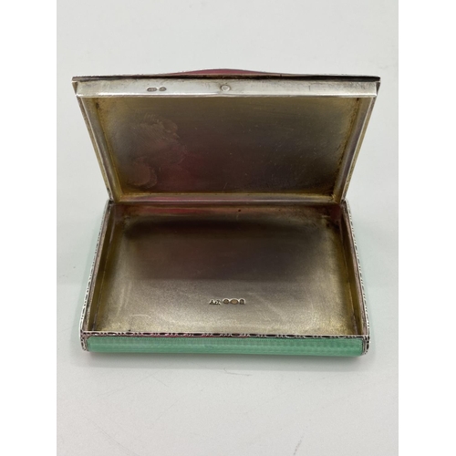 12 - A sterling silver and engine turned enamel pocket snuff box, stamped 925 with import marks, maker A ... 