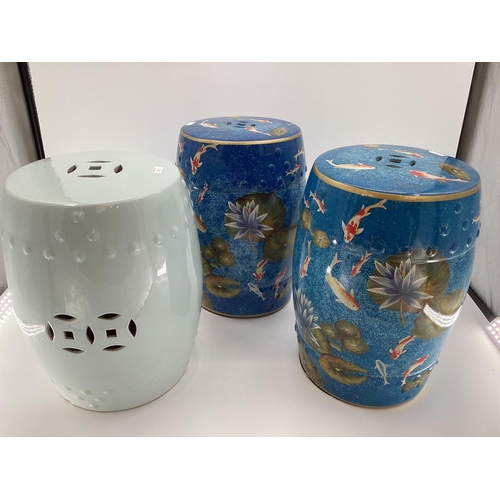 121 - Pair of modern china blue garden seat drums,  in the Chinese taste, decorated water, fish and foliag... 