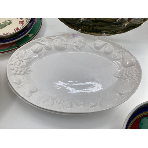 122 - A quantity of good decorative kitchen china to include large open platters, large open bowls, etc so... 