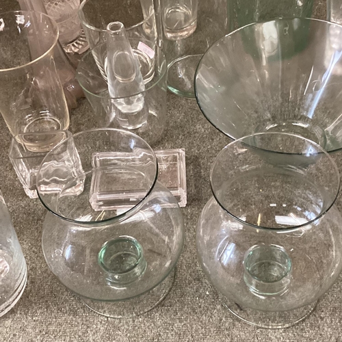 125 - A large quantity of glassware's to include:  candle holders, flower vases,  large bowls, fruit bowls... 