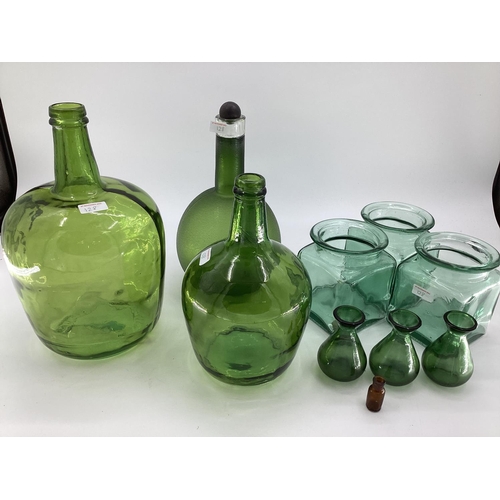 128 - A quantity of colourful decorative glassware's to include vases, bottle vases,