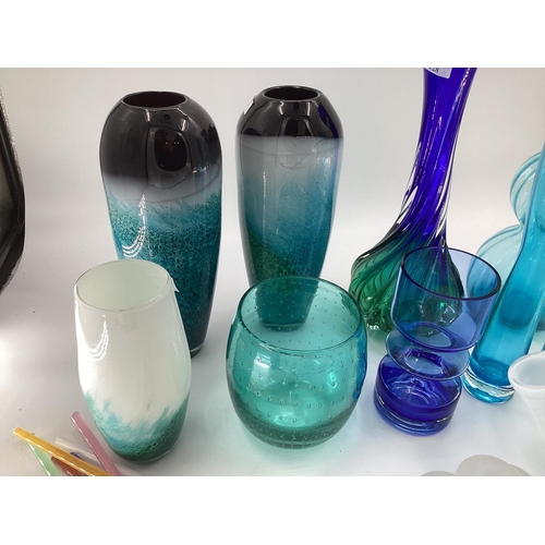 128 - A quantity of colourful decorative glassware's to include vases, bottle vases,