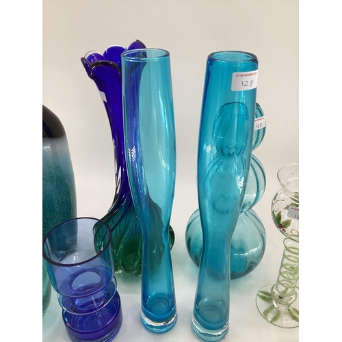 128 - A quantity of colourful decorative glassware's to include vases, bottle vases,