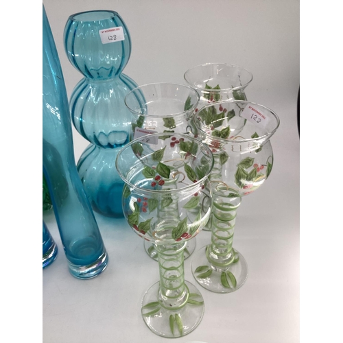 128 - A quantity of colourful decorative glassware's to include vases, bottle vases,